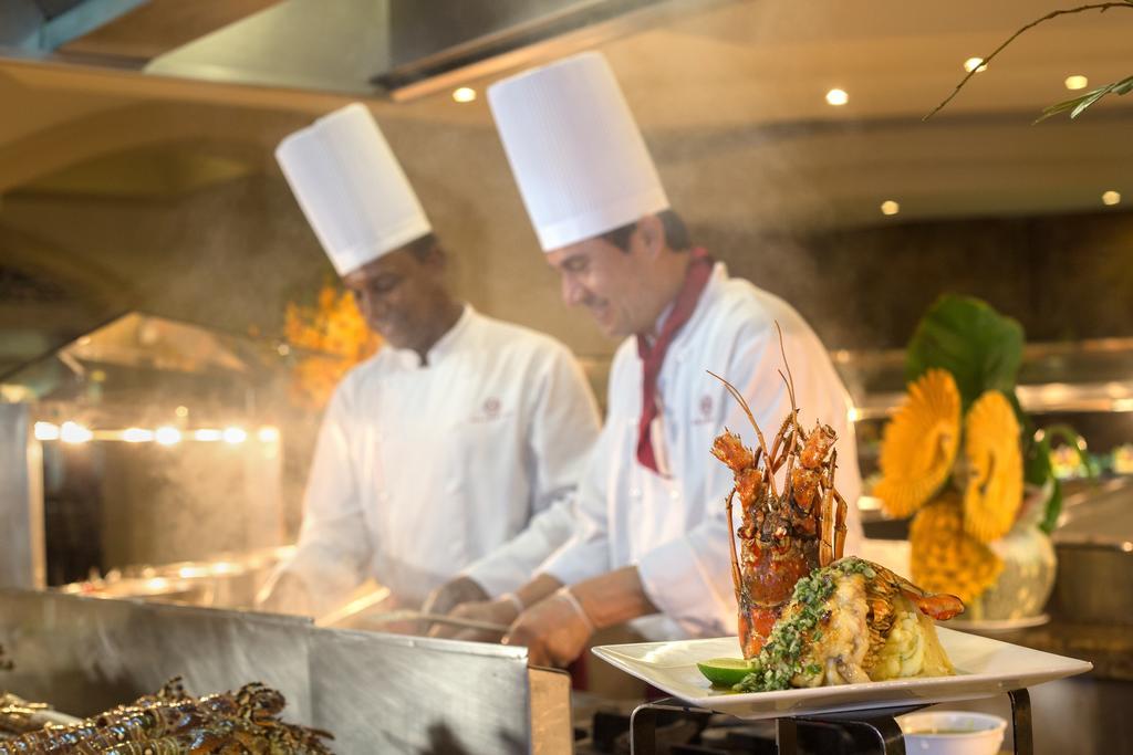 Majestic Elegance Punta Cana (Adults Only) Exterior foto Two chefs working in a hotel kitchen