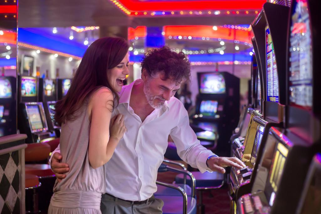 Majestic Elegance Punta Cana (Adults Only) Exterior foto A couple playing a slot machine